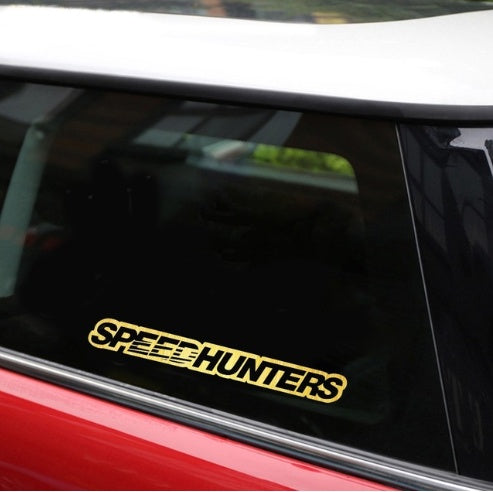Yellow 'SPEEDHUNTERS' decal on a car window