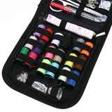 Sewing kit with colorful thread spools and tools in a black case
