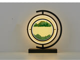 Decorative lamp with circular design and mountain landscape on a plain background