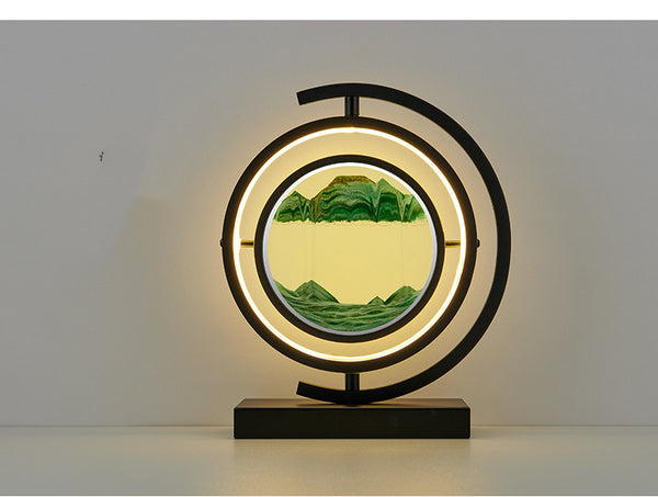 Decorative lamp with circular design and mountain landscape on a plain background