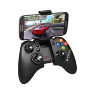 Black gaming controller with smartphone displaying a racing game on a white background