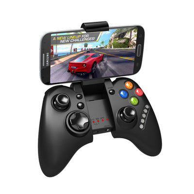 Black gaming controller with smartphone displaying a racing game on a white background