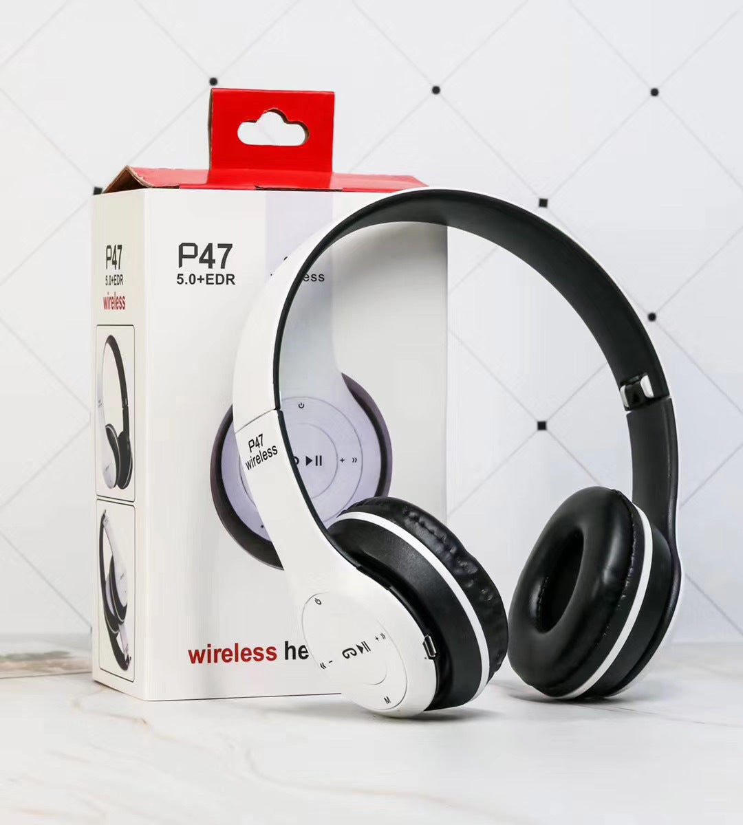 White headphones with black ear covers on a white box labeled 'P47' against a light gray background.