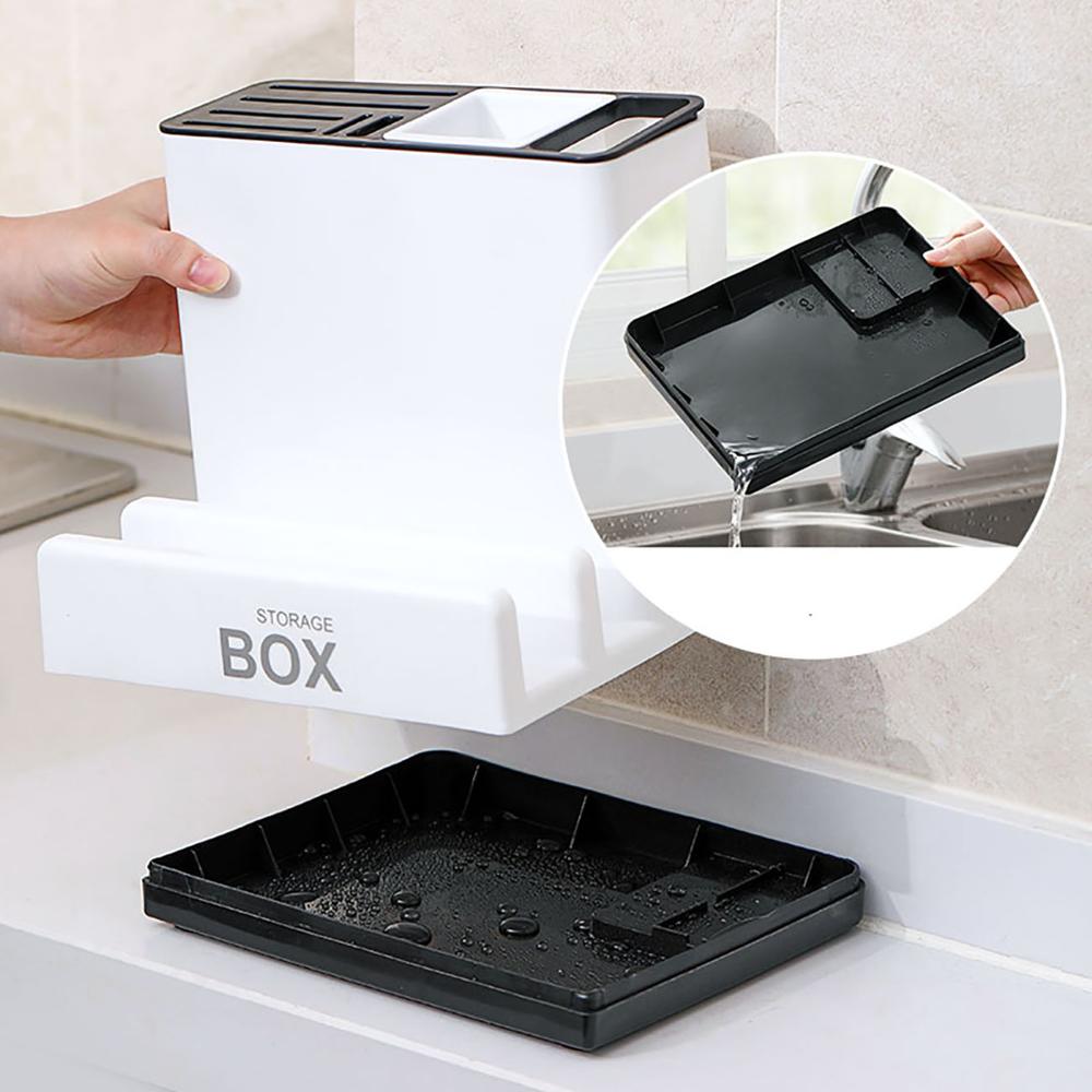 Black tray being used with a white storage box in a kitchen setting