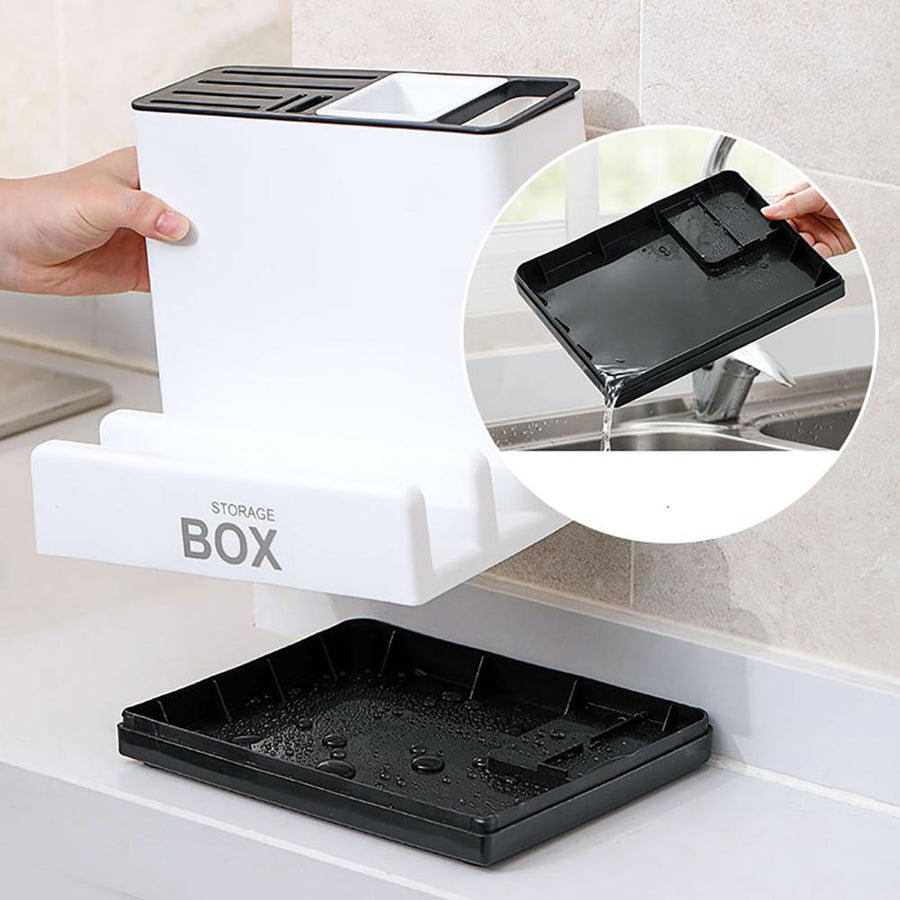 Black tray being used with a white storage box in a kitchen setting