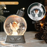 Decorative angel snow globe with lights and measurements, surrounded by pine cones.