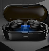 Black wireless earbuds in an open charging case on a dark background