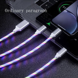 Multifunctional cable with colorful sheath connected to a laptop and phone on a dark surface.