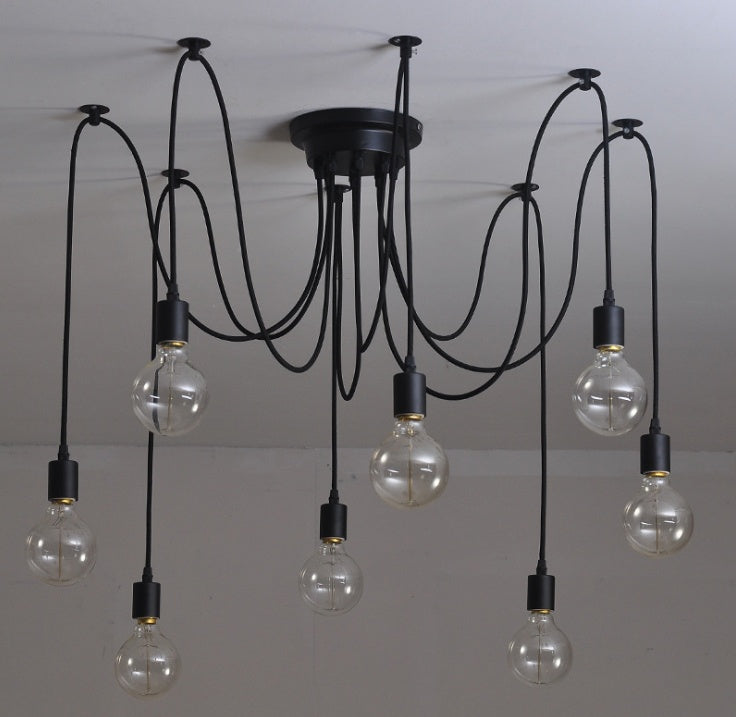 Modern chandelier with multiple hanging light bulbs on a plain background