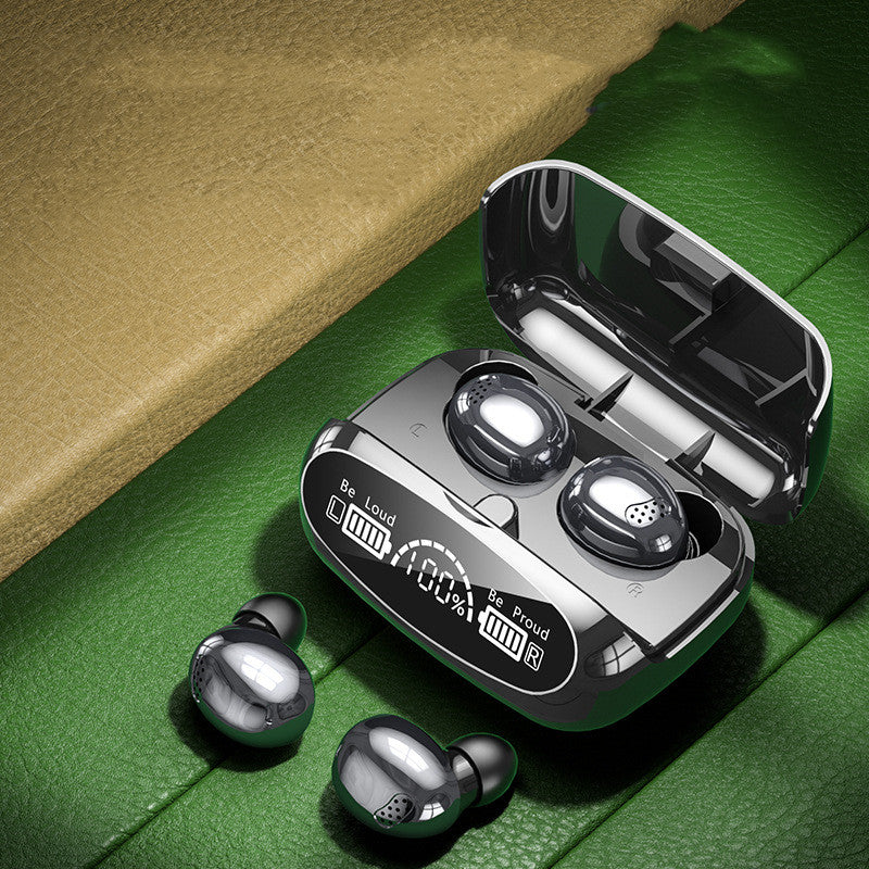 Wireless earbuds with charging case on a green surface