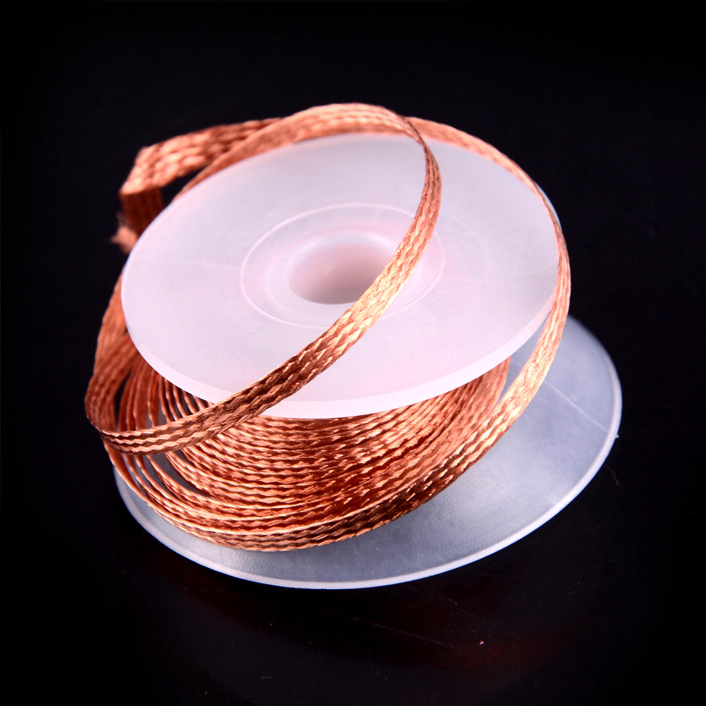 Spool of copper wire on a black background