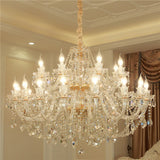 Luxurious crystal chandelier in a room with decorative elements.