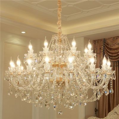 Luxurious crystal chandelier in a room with decorative elements.