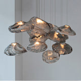Modern chandelier with glass shades on a neutral background
