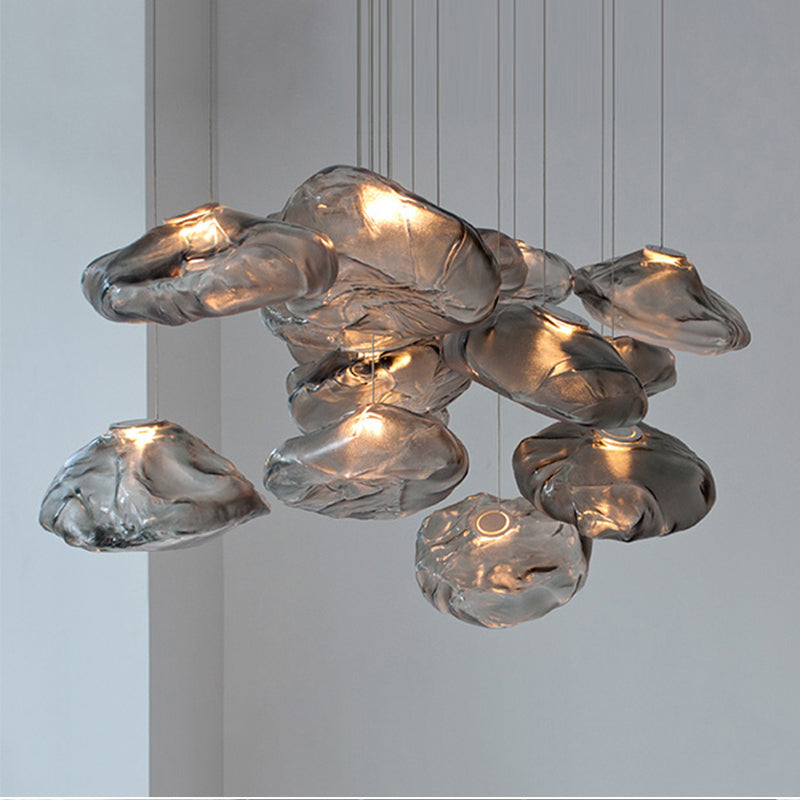 Modern chandelier with glass shades on a neutral background