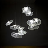 Modern chandelier with glass shades on a black background