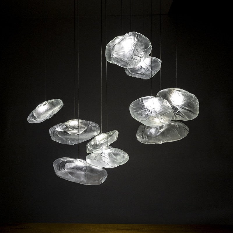Modern chandelier with glass shades on a black background