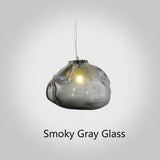Smoky gray glass pendant light on a white background