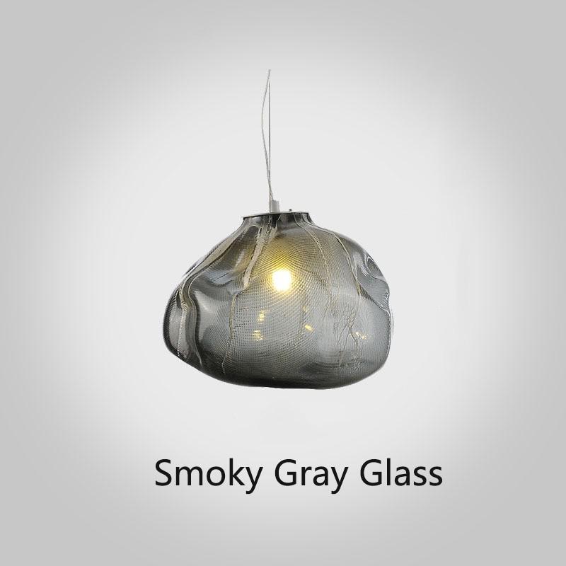 Smoky gray glass pendant light on a white background