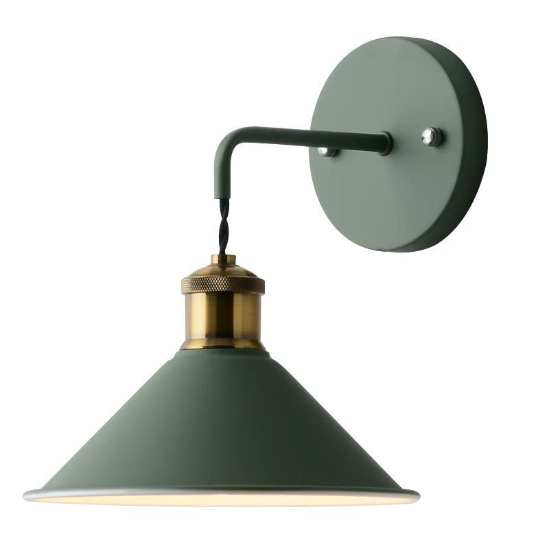Green wall-mounted lamp with brass fitting on a white background