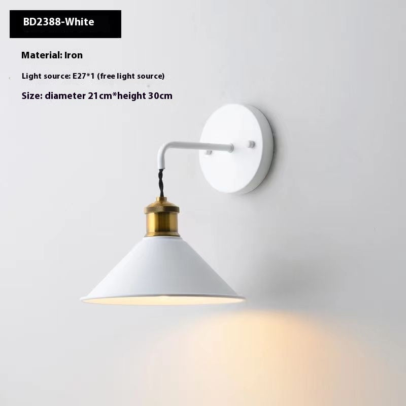 White wall-mounted lamp with gold accent on a light gray background