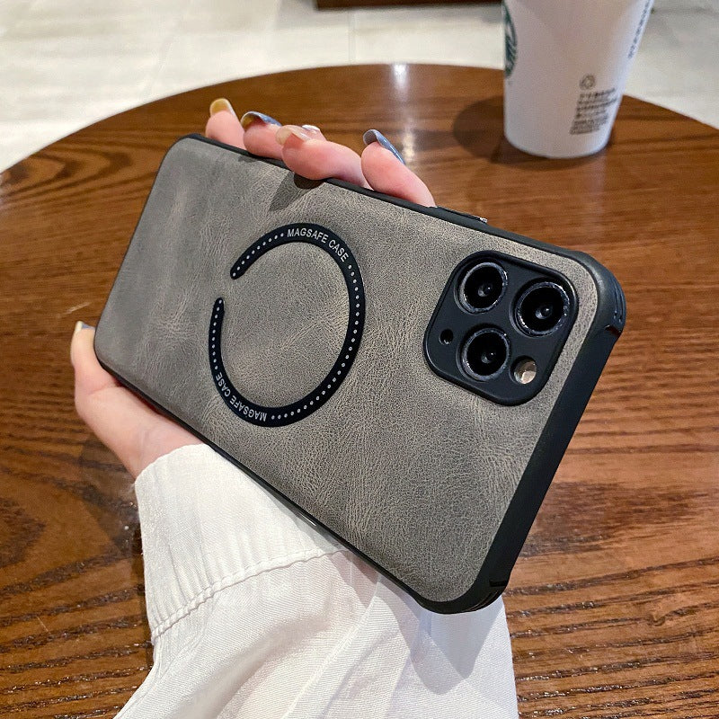 Person holding a gray phone case with a Starbucks cup in the background