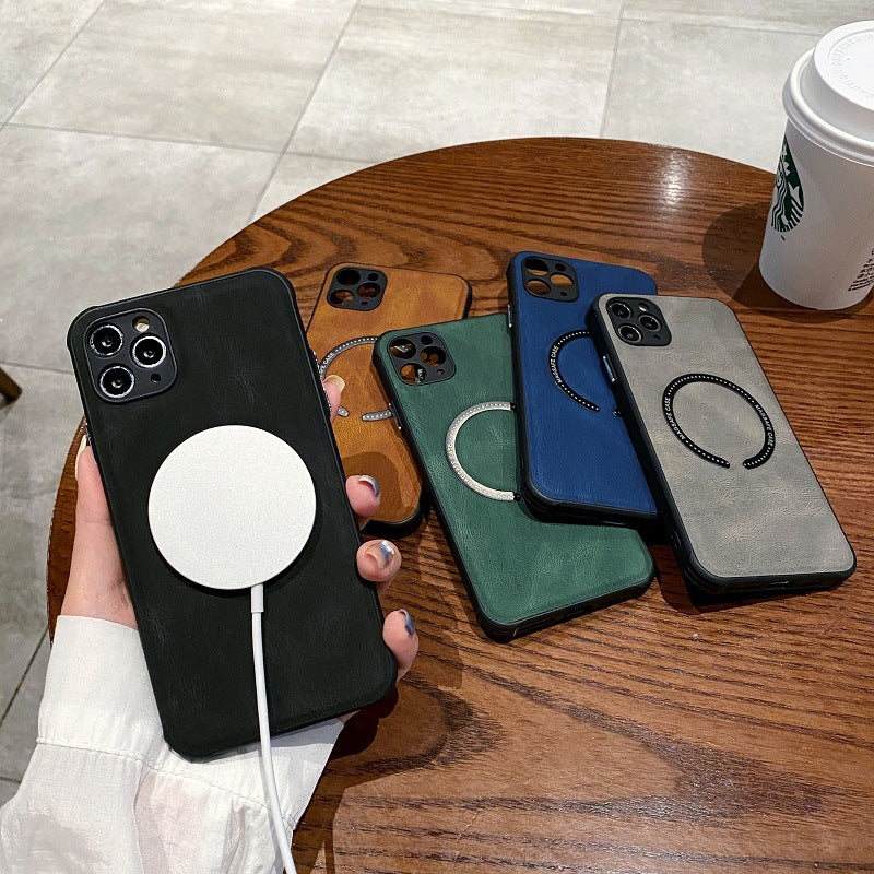 Five phone cases in different colors held by a hand on a wooden table with a Starbucks cup.