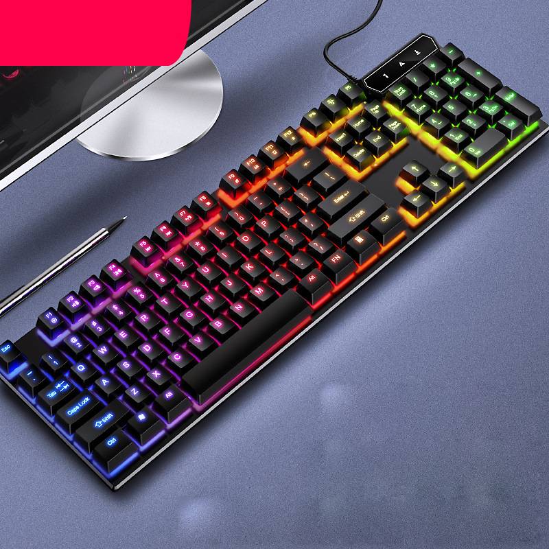 Colorful mechanical keyboard on a desk with a computer monitor in the background