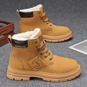 A pair of men's fleece-lined snow boots with water-resistant exterior and high-traction rubber treads