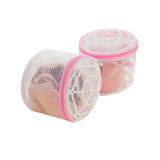 Two mesh laundry bags with pink zippers on a white background