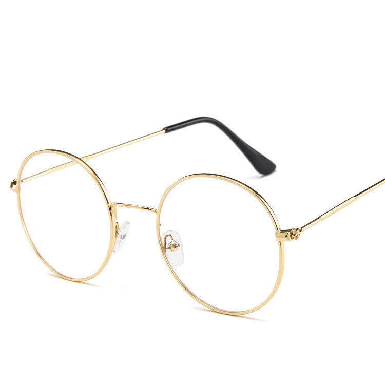Gold-framed eyeglasses on a white background
