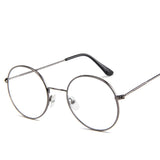 Round eyeglasses with thin metal frame on a white background