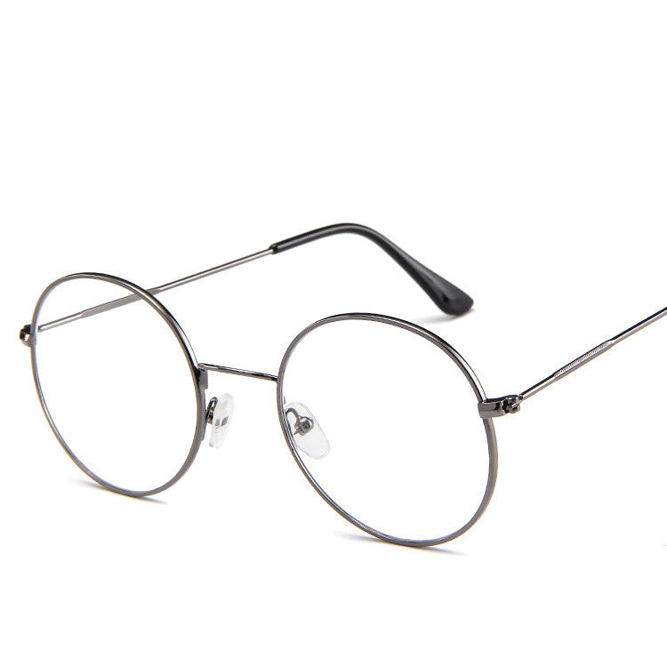 Round eyeglasses with thin metal frame on a white background