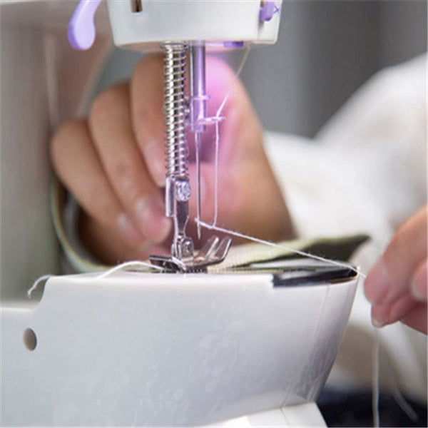 Close-up of a sewing machine needle and thread with a blurred background