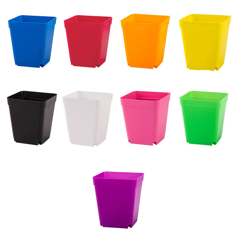 Set of colorful square planters on a white background