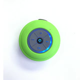 Green Bluetooth shower speaker with control buttons on a white background