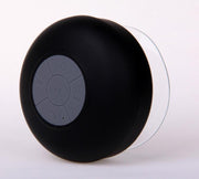 Black shower speaker with control buttons on a white background