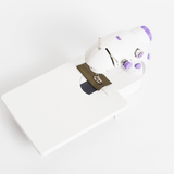 White sewing machine with a white background