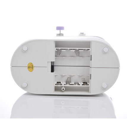 White sewing machine on a white background