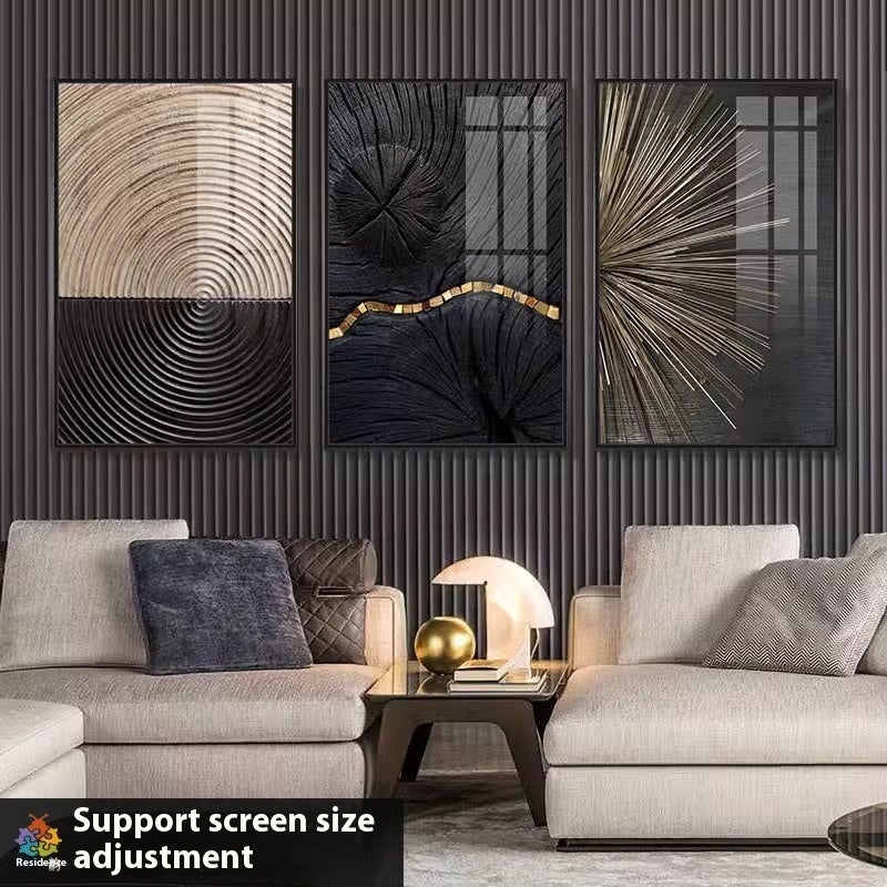 Modern living room with three abstract wall art pieces above a sofa.