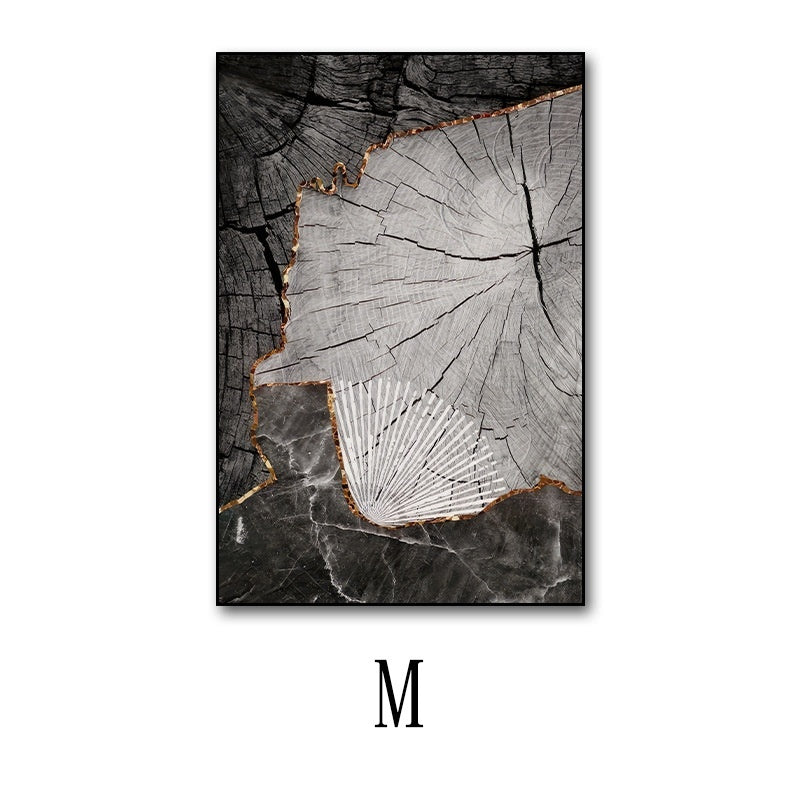 Artistic depiction of a tree stump with a white abstract design on a black background, featuring the letter 'M'.