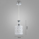 Pendant light with floral design shade and measurements on a gray background