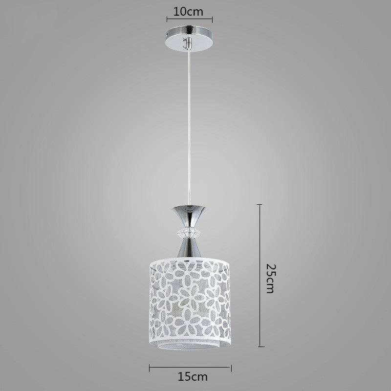 Pendant light with floral design shade and measurements on a gray background