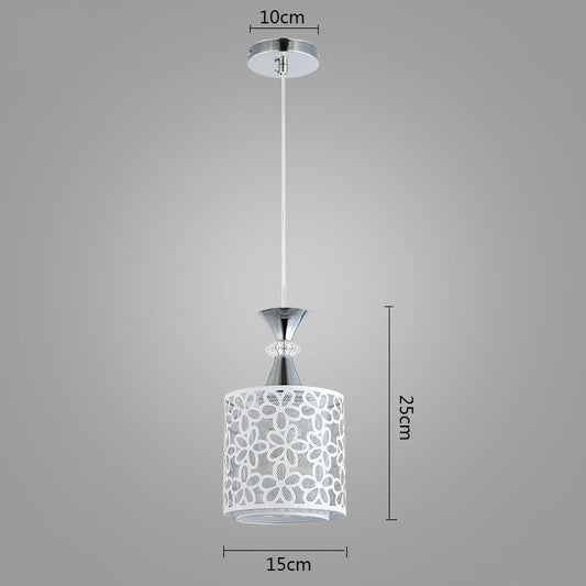 Pendant light with floral design shade and measurements on a gray background