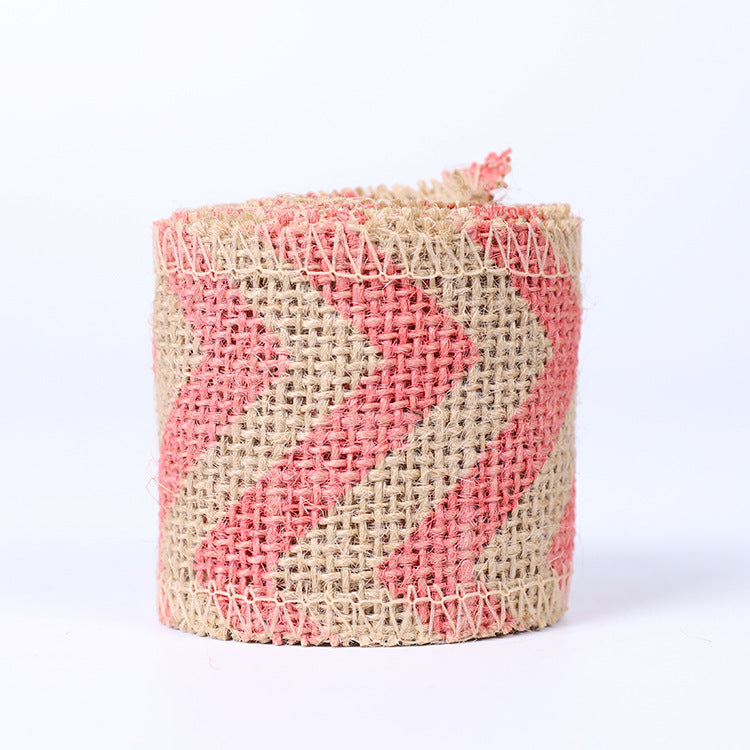 High-quality natural jute burlap ribbon roll with finished edges for rustic wedding decor, gift wrapping, and floral arrangements