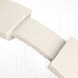 Beige stair runner with geometric pattern on a white wooden floor