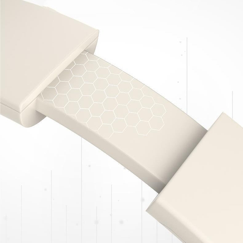 Beige stair runner with geometric pattern on a white wooden floor