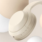 Beige headphones on a light beige background