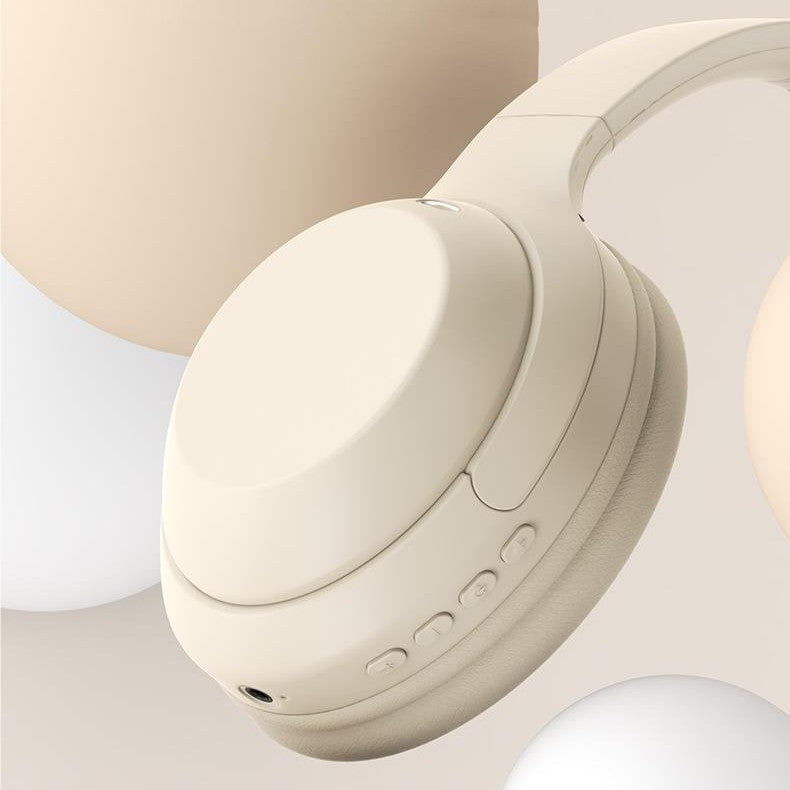 Beige headphones on a light beige background
