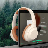 White headphones displayed on a laptop screen with a forest background